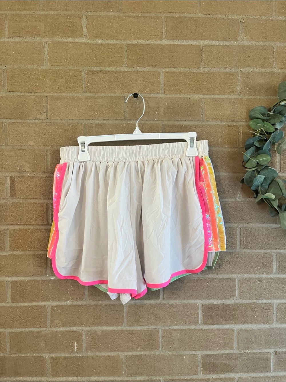QUEEN OF SPARKLES Cream Athletic Shorts with Neon Pink Trim - Picture 1 of 3